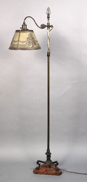 Antique floor lamp with patterned shade.