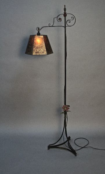Ornate floor lamp with floral accents.