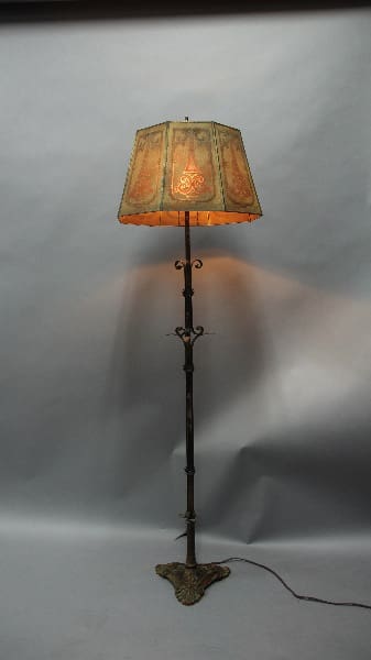 Ornate floor lamp with patterned shade.