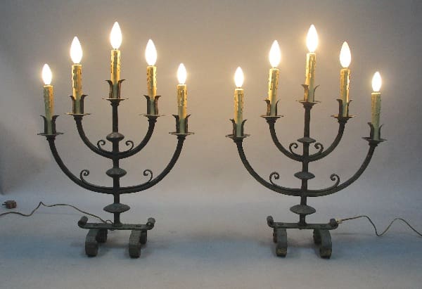 Two 12557. Pair Of 5 Light 1920's Spanish Revival Table Lamps, with multiple lit bulbs, placed symmetrically against a neutral background.