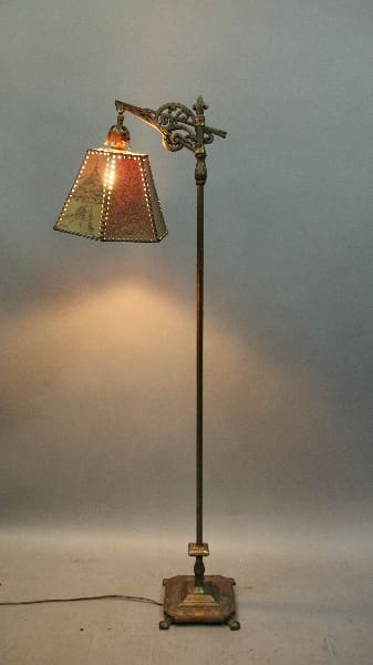 Ornate floor lamp with a lampshade.