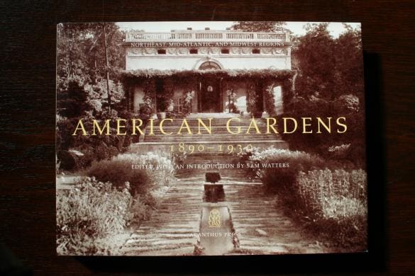 Product Name: 1284. American Gardens, 1890-1930 by Sam Watters

Sentence with replaced product:
Book titled "1284. American Gardens, 1890-1930 by Sam Watters" with a sepia-toned cover photo of a garden path, displayed on a wooden surface.