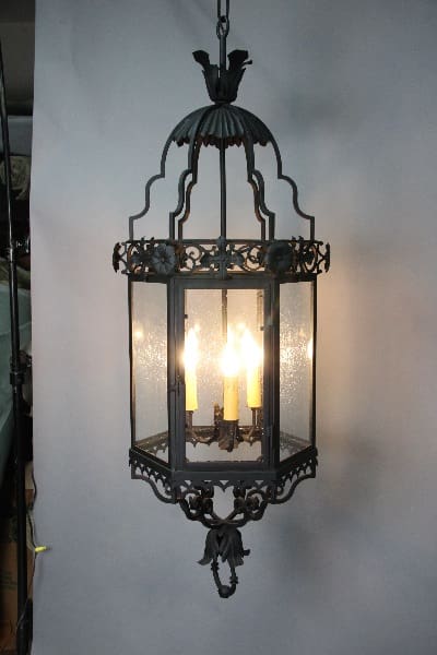 Ornate hanging lantern with candle-style lights.