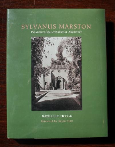 A green book titled "1299. Sylvanus Marton Pasadena's Quintessential Architect" by Kathleen Tuttle, featuring a black-and-white architectural photo on the cover.