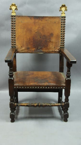 Antique wooden chair with ornate details.