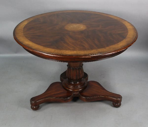 13128. 19th Century Center Table with an intricate grain pattern and a central pedestal, supported by three curved legs.
