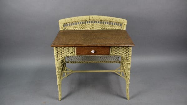 Vintage 13281 Arts And Crafts Wicker Desk With Oak Top writing desk with a single drawer, set against a plain gray background.