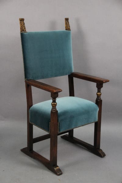 Vintage wooden chair with blue upholstery.