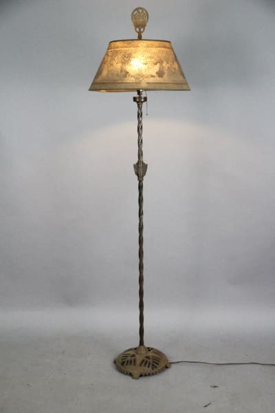 Vintage floor lamp with decorative shade.