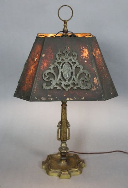 An 13354. Spanish Revival table lamp with a mica shade, showing visible signs of wear and discoloration.