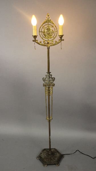 Vintage gold floor lamp with two bulbs.