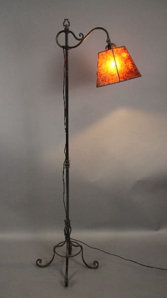 Floor lamp with an orange lampshade.