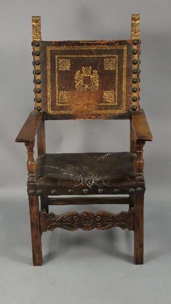 Ornate wooden chair with decorative backrest.