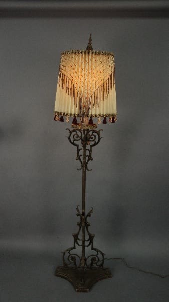 Antique floor lamp with decorative shade.