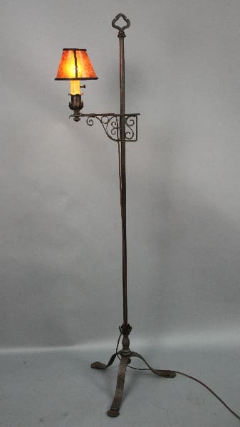 Vintage floor lamp with orange shade.