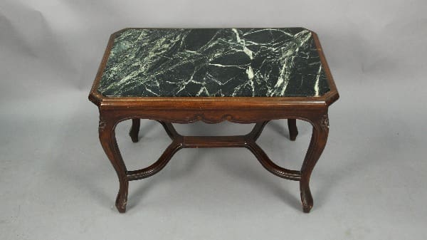 13593. Carved Walnut Side Table With Marble Top with ornate legs, placed against a plain gray backdrop.