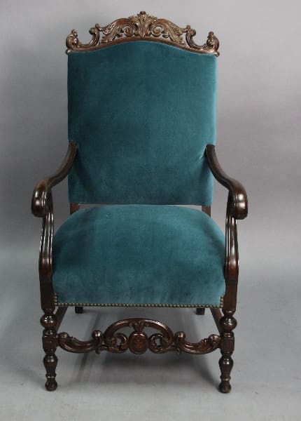 Victorian-style upholstered chair in teal color.
