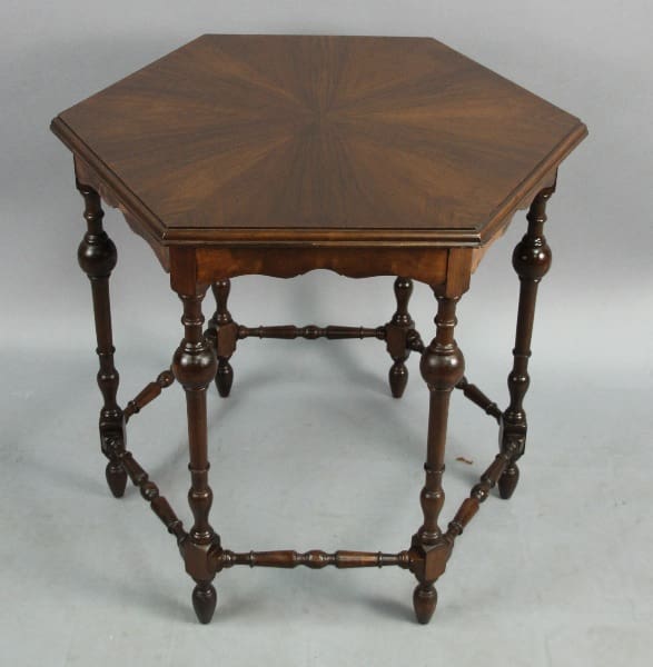 13753. 1920's Spanish Revival Hexagonal Table with ornate legs and a lower shelf, displayed against a gray background.