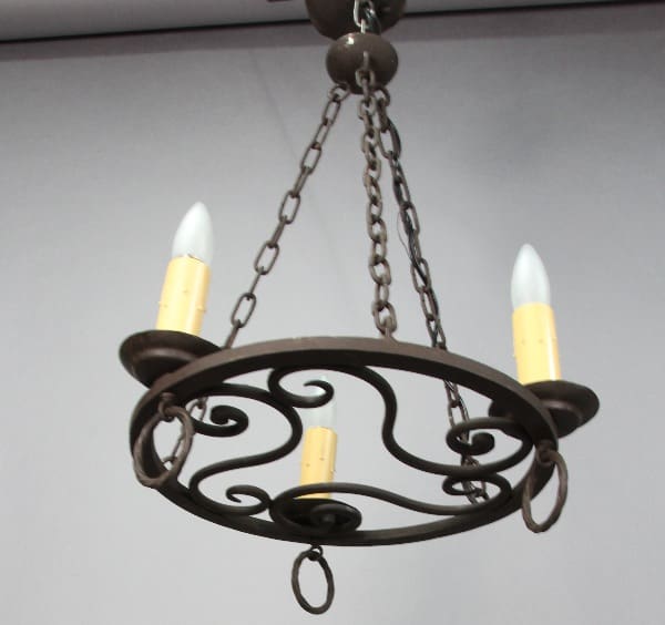 Chandelier with three decorative light bulbs.