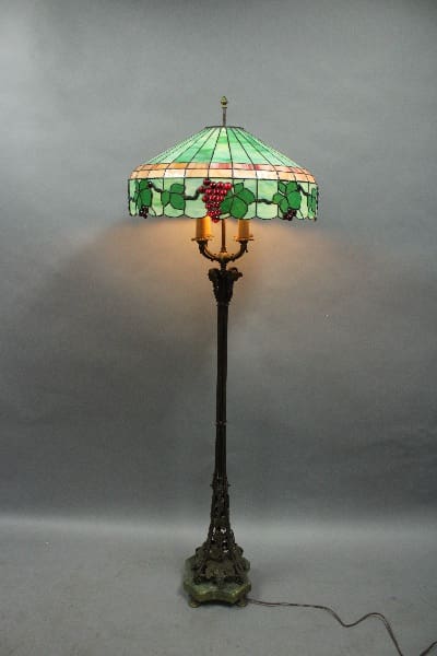 Stained glass floor lamp with grape design.