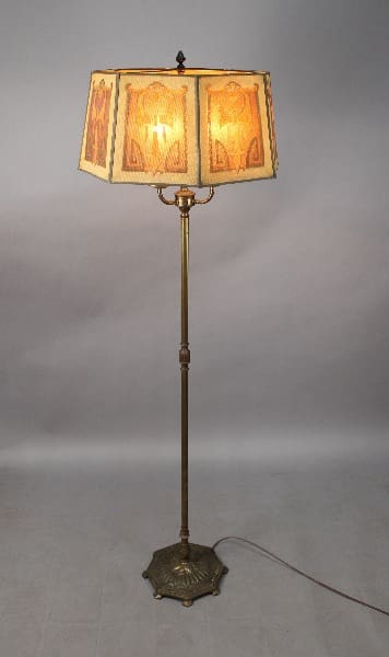 Vintage floor lamp with decorative shade.