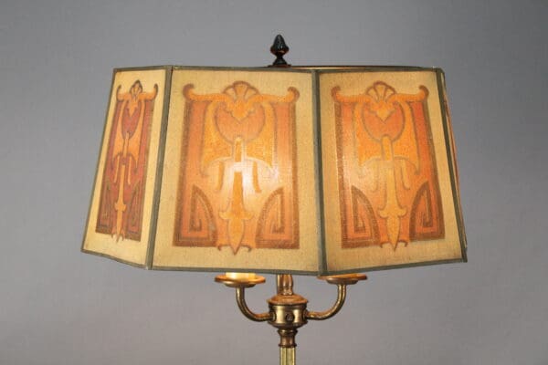 Art deco lamp with patterned shade.