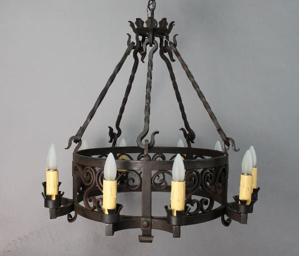 Vintage chandelier with multiple candle-like lights.