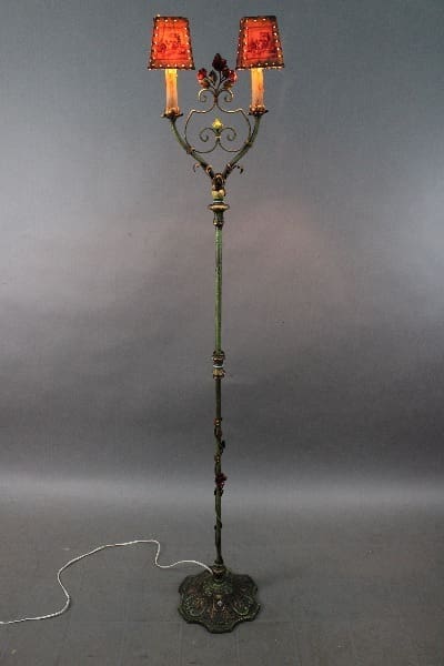 14520. Spanish Revival Floor Lamp With Polychrome Finish with dual red lampshades and ornate metal design, standing on a patterned base.