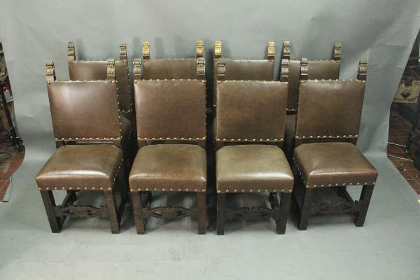 Brown upholstered dining chairs arranged in row.
