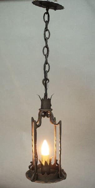 Hanging lantern with a candle flame.