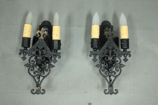 Vintage candle holders with ornate designs.