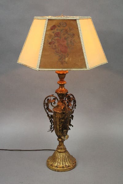 Antique ornate 14894. 1920's Table Lamp with a Acanthus Motif featuring floral designs, illuminated against a plain background.