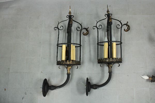 Elegant wall sconces with candle holders.
