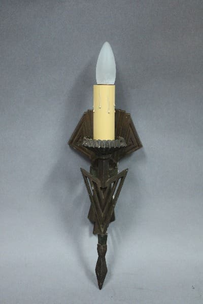 Art Deco wall sconce with candle design.