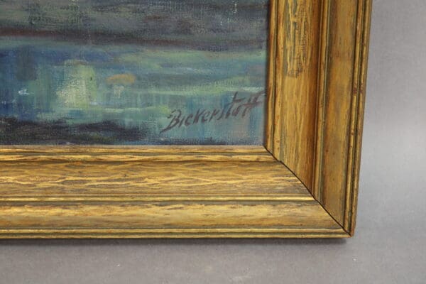 Painting corner with signature and ornate frame.