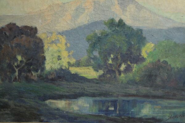 Mountain landscape with trees and water.