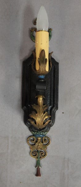 Ornate wall sconce with candle design.