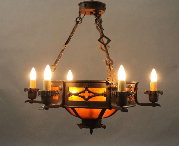 Vintage chandelier with warm glowing bulbs.