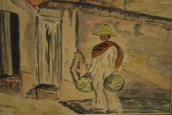 Person carrying baskets in a rural setting.