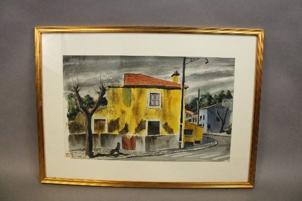Framed painting of a yellow house.