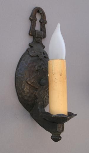 Antique candle holder with faux candle.