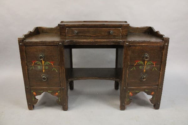 15162. Spanish Revival Desk Vanity Circa 1920's with decorative floral patterns on the drawers, scalloped edges, and a central raised section.