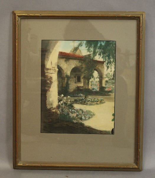 Framed painting of a garden landscape.
