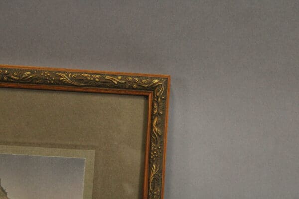 Decorative picture frame against a gray background.