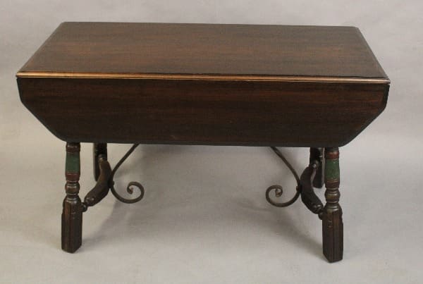 Antique 15179. Circa 1920's Dining Room Table with curved metal legs and green and red accents on the legs.