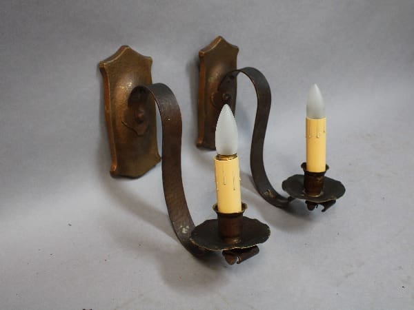 Vintage wall sconces with candle-shaped bulbs.