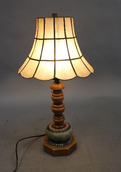 Vintage lamp with a soft, illuminated shade.