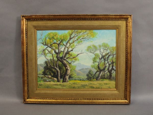 Framed painting of green trees and landscape.