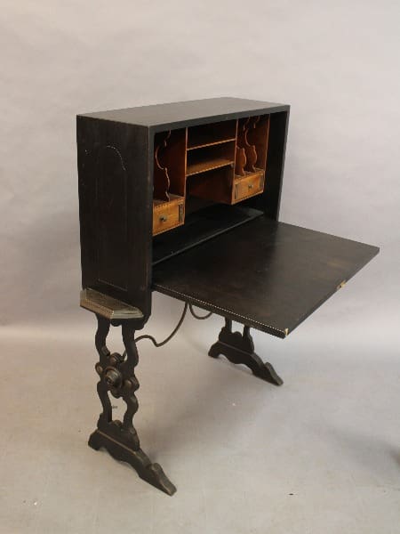 15378. Spanish Revival 1920's Writing Desk with an open writing surface, multiple compartments, and ornate metal legs on a plain background.