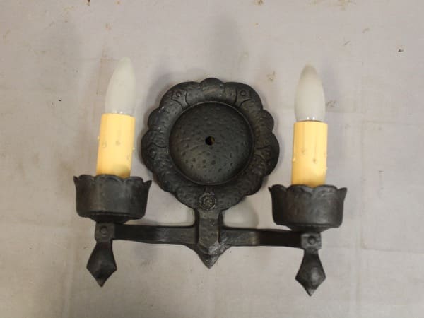 Vintage candle wall sconce with two holders.